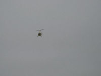N7523T @ SZP - 2004 Robinson R44 RAVEN II, Lycoming IO-540 derated to 245 Hp for 5 minutes, 205 Hp continuous, approaching SZP in low clouds and ground fog over river - by Doug Robertson