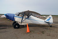N2737M @ OME - PA-12's abound in AK - by Duncan Kirk
