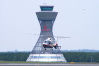 PH-EQU @ EGNT - in a hover taxi with Newcastle's impressive ATC Tower in the background - by Chris Hall