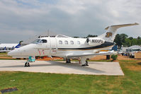 N100PU @ OSH - Embraer-empresa Brasileira De EMB-500, c/n: 50000220 on Static display at 2011 Oshkosh - by Terry Fletcher