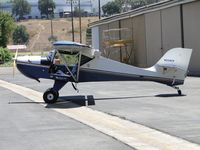 N234CV @ AJO - Parked by a hanger - by Helicopterfriend
