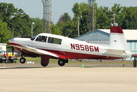 N9586M @ OSH - 1966 Mooney M20F, c/n: 670163 landing at 2011 Oshkosh - by Terry Fletcher