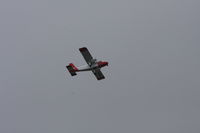 G-BCEN @ NONE - Seen carrying out either a search or aerial photography pattern over Carshalton Surrey 7/8/2011. Is the square opening in the fuslage a camera port ? - by John Murrell