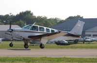 N124DH @ KOSH - Beech A36 - by Mark Pasqualino