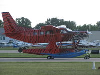 N31JA @ KOSH - Tiger stripped Quest on floats EAA 2011