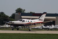 N51LG @ KOSH - Socata TBM 700 - by Mark Pasqualino