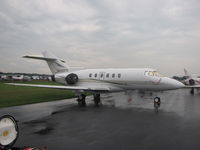 N438PM @ KOSH - on a grey wet day during EAA 2011 - by steveowen