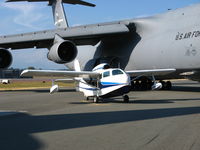 N217G @ CYXX - Abbotsford Airshow 2011  
Republic Seabee N217G under the wing of a C-5 in the static aircraft display. - by Tom Hoag