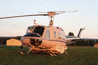 N658HA @ SEG - A twilight shot of a Huey with the moon out - by Duncan Kirk