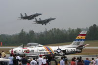 N86FS @ KFFC - A pair of Eagles make a low pass down the runway while Wyatt Fuller's F-86 is resting between flights. - by Gregg Stansbery