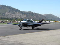N5619K @ SZP - 1964 Beech S35 BONANZA, Continental IO-520-B 285 Hp, taxi - by Doug Robertson