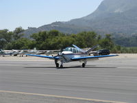 N7947K @ SZP - 1964 Beech S35 BONANZA, Continental IO-520-B 285 Hp, taxi off the active - by Doug Robertson