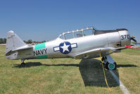 N7090C @ OSH - North American SNJ-4, c/n: 88-13370 ex Bu27754
at 2011 Oshkosh - by Terry Fletcher
