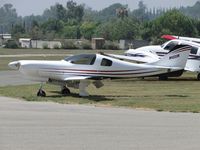 N1222K @ RIR - Parked in the grass - by Helicopterfriend