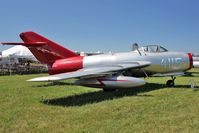 N15MG @ OSH - 1954 Mikoyan MIG-15BIS, c/n: 1411 WHITE 4115 at 2011 Oshkosh - by Terry Fletcher