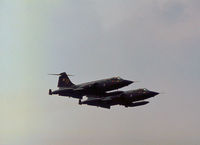 104843 - CF-104 Starfighters 104843 and 104751 of 439 Squadron Canadian Armed Forces in action at the 1977 International Air Tattoo at RAF Greenham Common. - by Peter Nicholson