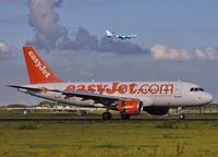 HB-JZP @ EHAM - Roll out on 18R,
in the back KLM Boeing 747-406 on final approach
to runway 18C.