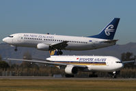 ZK-SJB @ NZCH - and SQ298 (9V-SRN) waits - by Bill Mallinson