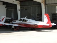 N1021U @ CCB - Parked in the Foothill Sales & service area, cowling off - by Helicopterfriend