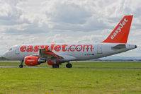G-EZFO @ EGGP - On taxiway awaiting clearance to enter runway 27. - by Mark J Kopczewski