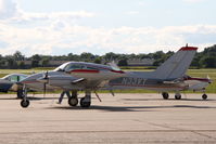 N33VT @ KIOW - Being pre-flighted for departure - by Glenn E. Chatfield