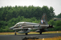 K-4010 @ EHTW - NF-5B two-seat trainer of 313 squadron of the Royal Netherlands Air Force about to take off from Twente air base. Note the badge of Luftwaffe wing JaboG 36 from adjacent Hopsten air base in Germany.