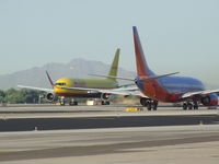 N769AX @ PHX - DHL cranking it up with Southwest waiting its turn - by Sgt_Eagar