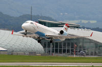 OE-LCM @ LOWS - Hangar 7 at background - by Lötsch Andreas