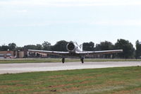 N332CA @ KDPA - Beginning take-off roll on runway 27 - by Glenn E. Chatfield