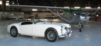 CF-WGW @ PU6 - CF-WGW parked next to a 1961 MGA in hanger at Deseronto, Ontario - by Dave Carnahan