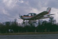 G-BAAI - Landing at South Marston A/F (01). At the time was owned by a local farmer, Fred Butcher who occasionally brought it to South Marston for glider towing at the Swindon Gliding Club - by Miles Dugmore