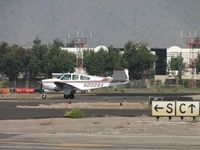 N2028A @ POC - Rolling out after landing passing taxiway Cocco - by Helicopterfriend