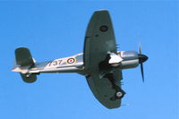 N56SF @ KDPA - On approach to runway19R fly close to the old control tower.  35mm slide - by Glenn E. Chatfield