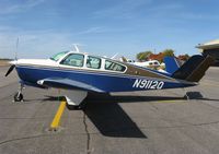 N9112Q @ KAXN - Beech V35B Bonanza on the line. - by Kreg Anderson