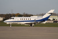 N899AB @ KDPA - Between flights - by John Meneely