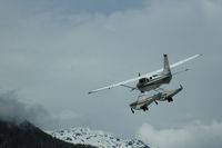 N50159 - Sunrise Aviation Pilot/Owner airborne from a gravel strip in NW British Columbia in his 1972 Cessna 206. - by David N Docherty