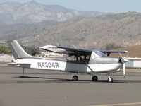 N4304R @ POC - Shielded and tied down in transient parking - by Helicopterfriend