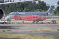 N99800 @ OPF - Beech H18 behind a couple of fences