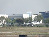 N143AL @ POC - Getting ready to touchdown on runway 26L - by Helicopterfriend