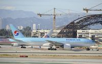 HL7714 @ KLAX - Getting towed to gate at LAX - by Todd Royer