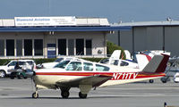 N711TV @ KSQL - Locally-based 1965 Beech S35 Bonanza taxis at San carlos, CA - by Steve Nation