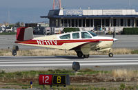N711TV @ KSQL - Locally-based 1965 Beech S35 Bonanza rolling at San Carlos, CA - by Steve Nation
