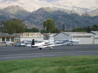 N711WZ @ SZP - 1990 Mooney M20M Turbo BRAVO, Lycoming TIO-540-AF1A 270 Hp, taxi to Rwy 22, that's snow in the higher mountains - by Doug Robertson