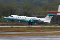 N451ST @ PDK - JM Aviation's 2002 Bombardier Learjet 45 N451ST departing RWY 2R in rainy conditions. - by Dean Heald