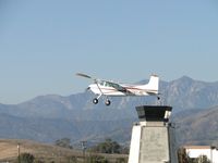 N7824K @ POC - Passing the control tower and heading west - by Helicopterfriend