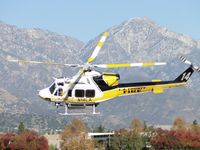 N14LA @ POC - Copter 14 responding on a call out for a medical transportation. Air taxied on Cocco turned hard left to runway 26L and departed - by Helicopterfriend