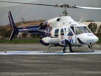N427MA @ POC - Appears mechanic exited and responded to pilot's side to check something - by Helicopterfriend