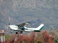 N1388S @ POC - Airbourne from runway 26R, passing the autumn trees - by Helicopterfriend