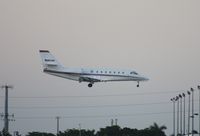 N382QS @ MIA - Net Jets C680 landing in the dark