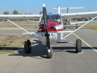 N97AV @ KTLR - Head on shot of highly modified 1979 Cessna 182Q with bush operations big wheels and canards on forward fuselage (parked on sloping taxiway!) @ Tulare, CA - by Steve Nation